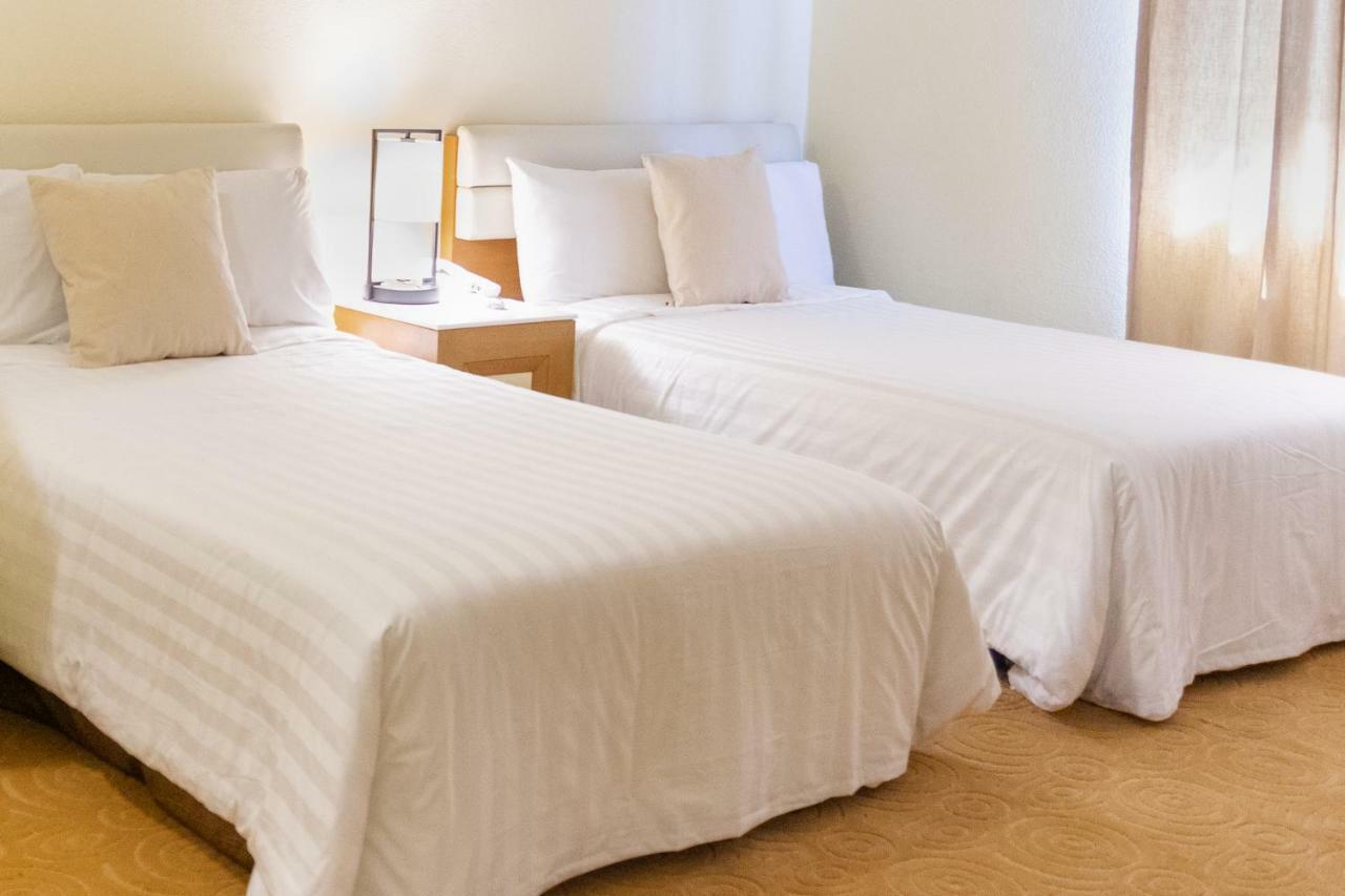One Pacific Hotel Тамунинг Екстериор снимка